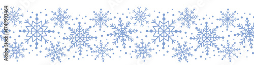 Seamless border with blue snowflakes isolated on white. Horizontal pattern with decorative winter elements