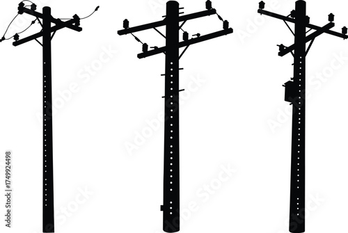 Silhouette of utility poles with crossarms, insulators, electrical components, varied wiring configurations, electricity distribution, urban infrastructure, industrial landscape, high voltage grid