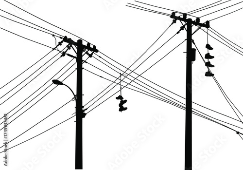 Silhouette of utility poles with power lines, insulators, streetlight attachment, rural electricity distribution, energy infrastructure, industrial landscape, high voltage grid