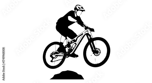 Silhouette of Mountain Biker in Action, Jumping over a Small Hill.