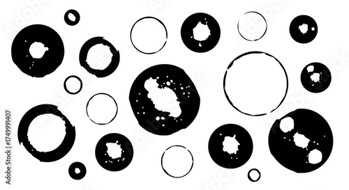 Black and White Ink Blot Circle Shapes with Textured Edges and Variations.