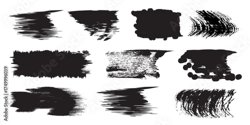 Collection of nine distinct black ink brush stroke textures and abstract paint splatters on a white background