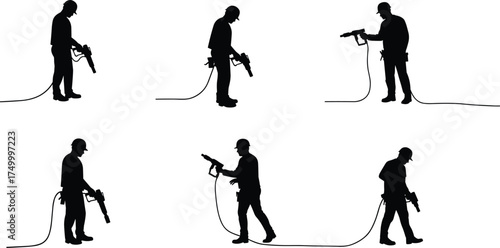 Construction workers silhouettes using jackhammers, demolition work, heavy equipment operation, safety helmet labor, industrial site, engineering project, urban development, road repair