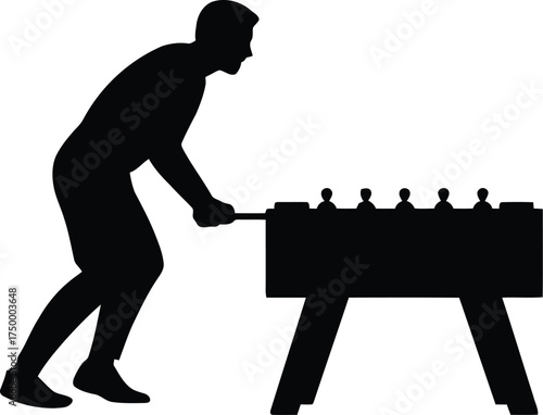 Silhouette of a Man Playing a Game of Table Football (Foosball)