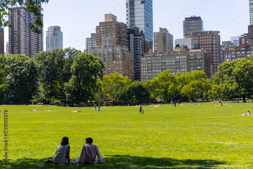 People relaxing on the lawn in Central Park, New York City