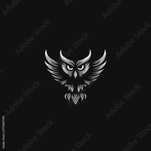 Powerful monochromatic stylized owl emblem with spread wings and fierce eyes on a dark background. Graphic design element for logo or mascot.