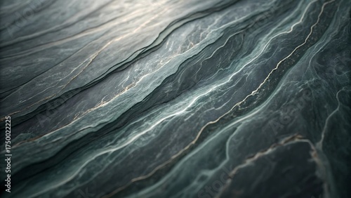 Abstract dark grey and green marble texture with flowing veins and natural stone patterns
