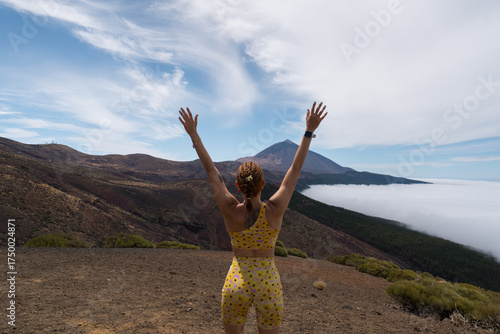 Woman hiking tenerife teide volcano feeling freedom