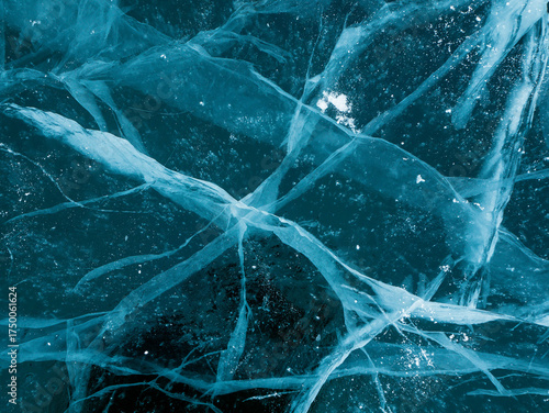 A detailed closeup view of a cracked and fractured piece of ice