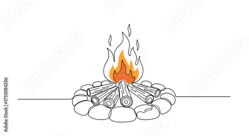 A crackling campfire burns brightly in the dark surrounded by a ring of stones.