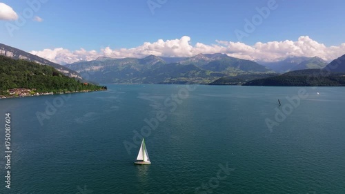 The beautiful Interlaken valley and Thunersee lake, Beatiful river at Switzerland in sunny day during summer, Aereal drone view of stunning idyllic nature scenery of lake Brienz with turquoise waters