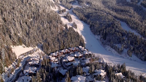 Alpine homes on hill at sunset, Whistler Mountain, aerial footage, winter scene, log cabin, luxury vacation home, mountain home. 4K 24FPS