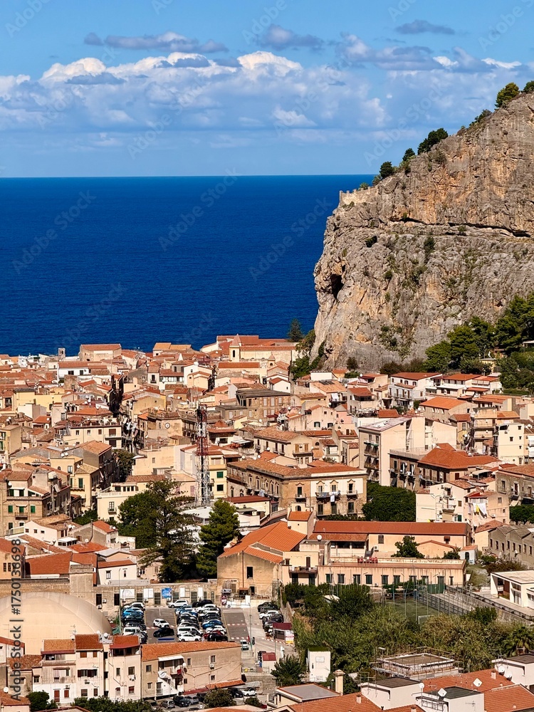 Obraz premium Cefalu, a historic Sicilian coastal town in northern Sicily, Italy, charming narrow streets, the Cathedral Basilica of the Transfiguration of the Lord, golden beach, and view of the Tyrrhenian Sea