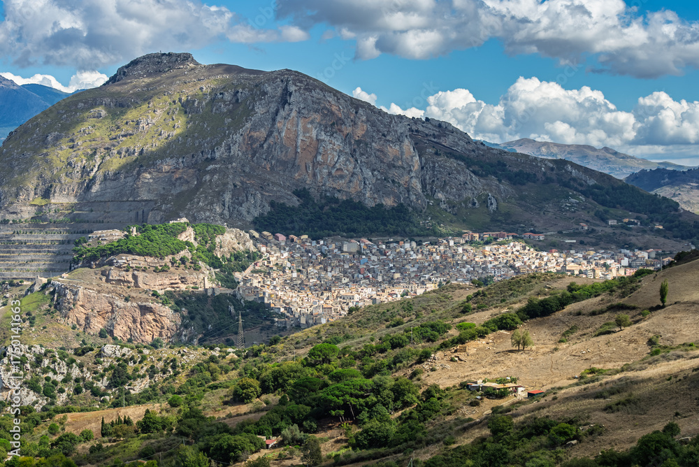 Fototapeta premium Caltavuturo, a historic Sicilian mountain town in the Madonie Mountains, featuring its medieval castle, charming narrow streets, and traditional stone houses, Sicily, Italy. Italian town in hills