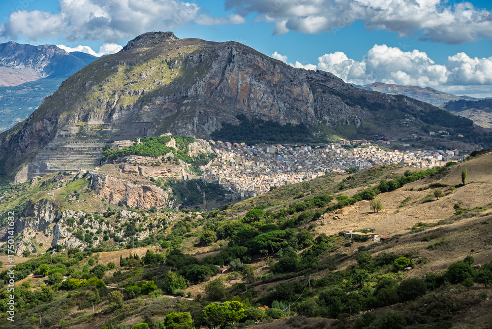 Fototapeta premium Caltavuturo, a historic Sicilian mountain town in the Madonie Mountains, featuring its medieval castle, charming narrow streets, and traditional stone houses, Sicily, Italy. Italian town in hills