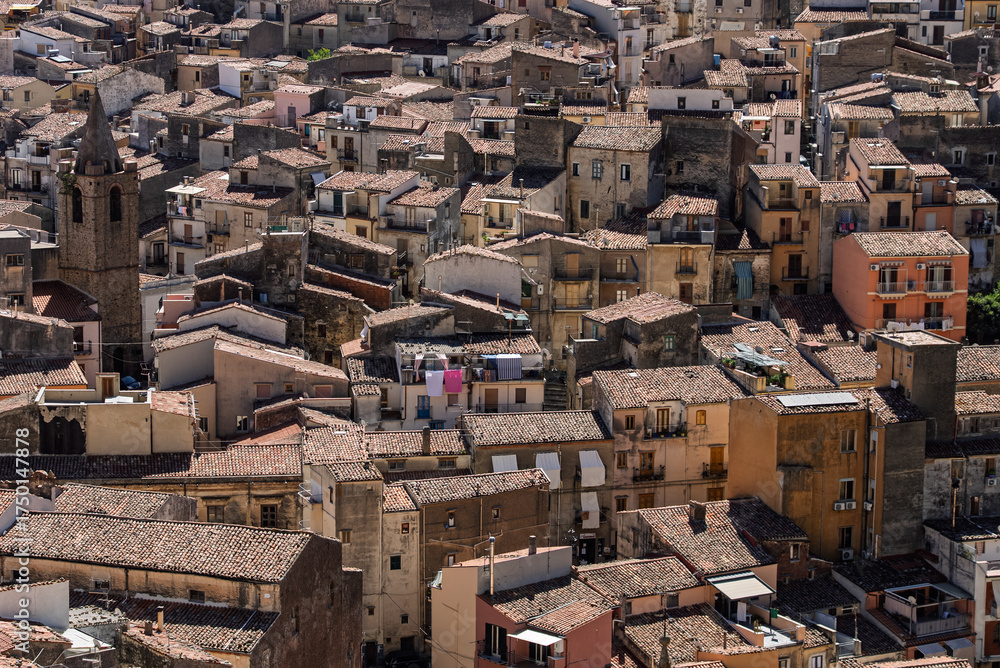 Fototapeta premium View of Isnello, a historic Sicilian mountain town in the Madonie Mountains, featuring charming narrow streets, traditional stone houses, and a Gothic church, Sicily, Italy. Italian town in hills