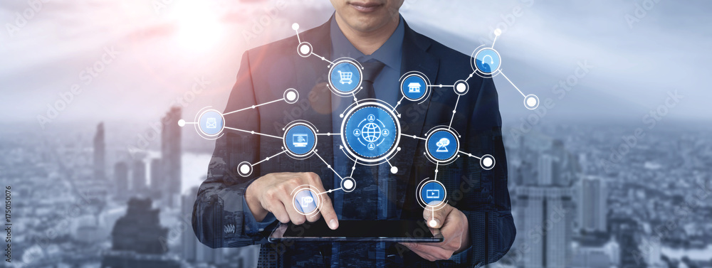 Obraz premium A businessman interacts with a digital tablet in an urban environment, showcasing network connections and symbols of technology and ecommerce, representing modern business trends. Tessel