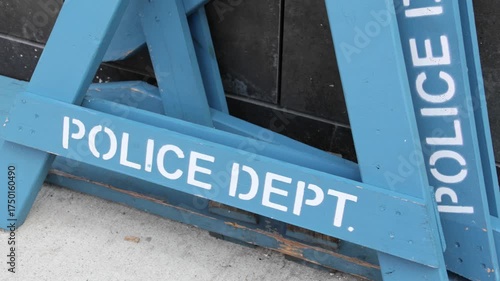 police department line do not cross nypd barricade blue road block wooden barrier piled on sidewalk in brooklyn new york (crime protest closure) dept storage criminal