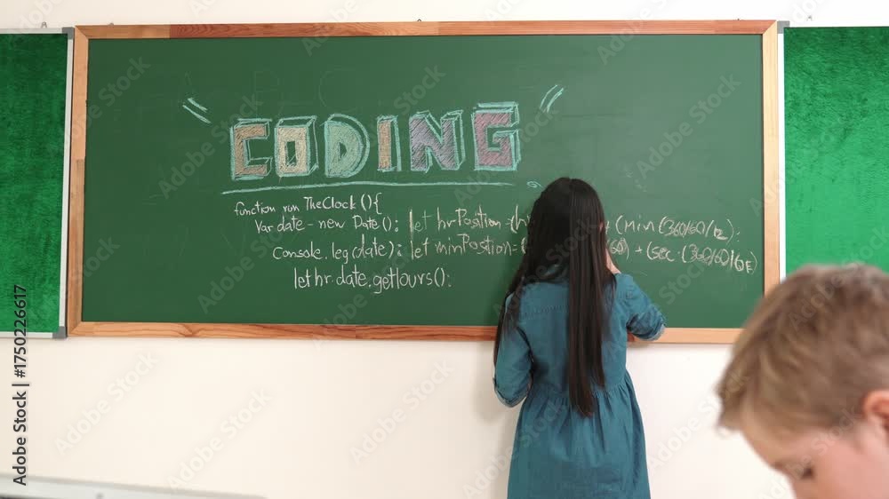 Asian boy coding program while caucasian friend fixing electric board ...