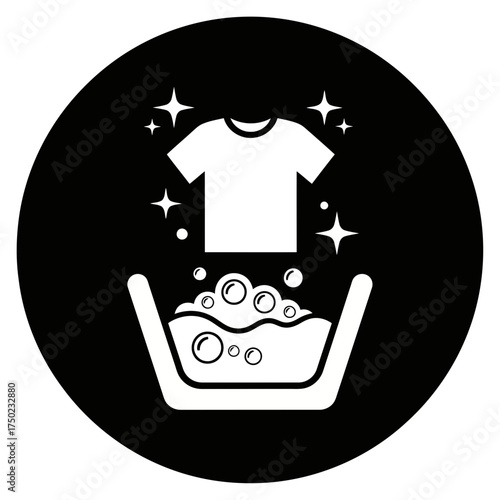 Clean white tshirt sparkling above a basin filled with soapy water and bubbles, representing laundry or washing clothes