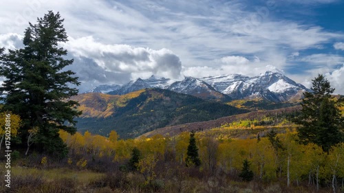 Colorful Autumn timelapse looking towards snow covered Timpanogos Mountain in Utah during the peak Fall season.