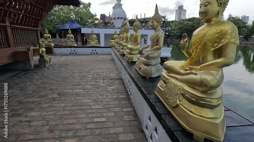 Line of Golden Buddha Statues at Gangaramaya Temple, Colombo, Sri Lanka