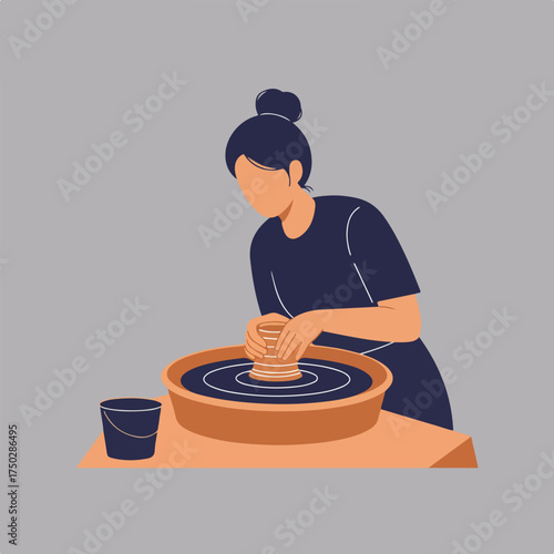 Person working at a pottery wheel creating a vase, with bucket nearby