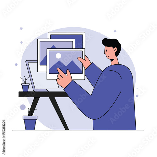Digital artist curating images on a laptop screen and tablet