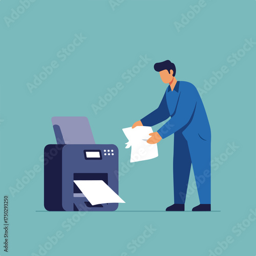 A man in a blue uniform operates a printer, inserting a paper