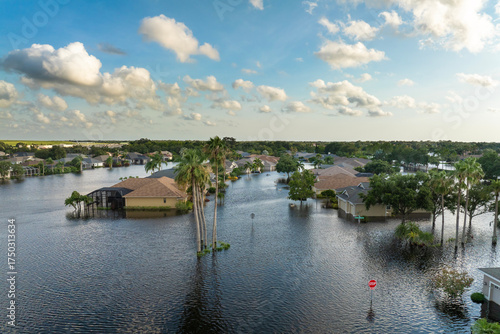 Flooding in Florida caused by tropical storm from hurricane Debby. Suburb houses in Laurel Meadows residential community surrounded by flood waters in Sarasota. Aftermath of natural disaster