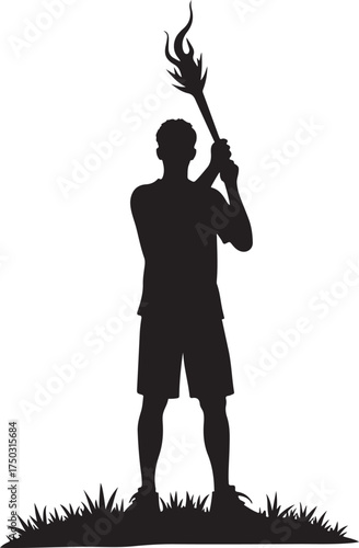 Black silhouette of a person holding a flaming torch on grass