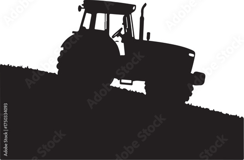 Black silhouette of a tractor on a plowed field black and white