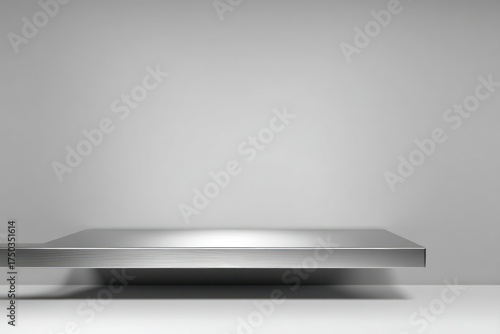 Metallic shelf on a gray background