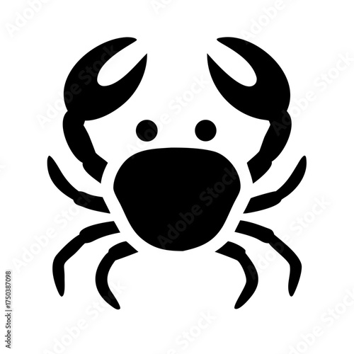 A close up shot of a black cat s face with piercing green eyes looking directly at the camera in a studio setting with a dark background