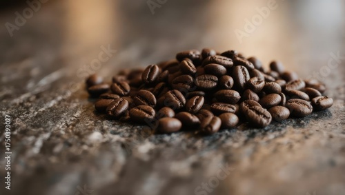 Close up of roasted coffee beans on a textured surface.