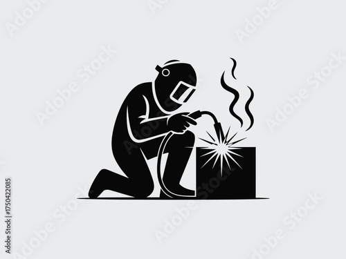 Black silhouette of welder working on metal welding metalwork
