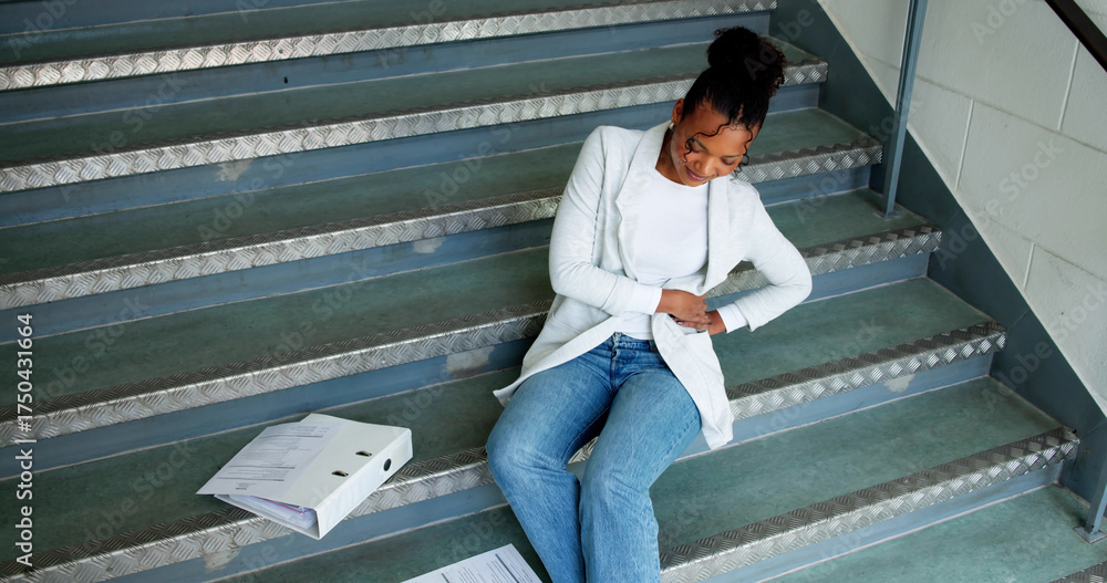 © Andrey Popov - Woman Falls Down Stairs At Work, Injures Back And Knee © Andrey Popov - Woman Falls Down Stairs At Work, Injures Back And Knee