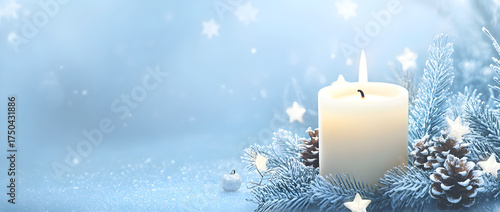 A soft blue background with a large, lit candle in the center, surrounded by Christmas decorations like small white stars and pine cones