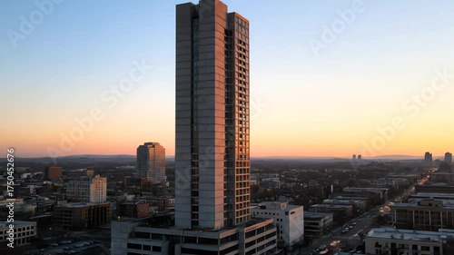 Aerial Sunset to Dusk Time-Lapse of Modern Skyscraper and Cityscape