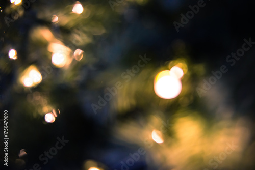 Soft bokeh lights glowing warmly in the darkness, creating a calm and dreamy atmosphere.