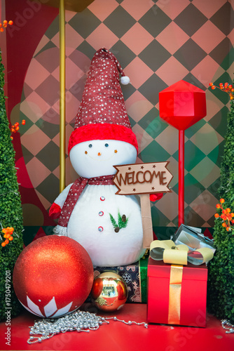 Christmas tree, gift box, ball and snowman display during the Christmas season for a photography.