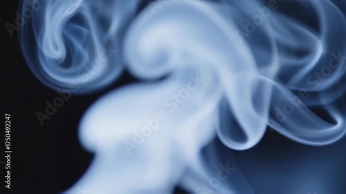 Abstract Blue Smoke Swirling Against Black Background, Artistic Vapor.