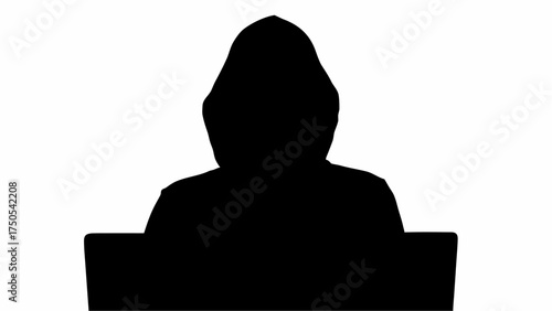 Mysterious figure in a hood working on a laptop, symbolizing digital anonymity and online activity