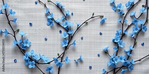 Delicate blue floral vines intertwine on natural linen fabric,  craft,  close-up
