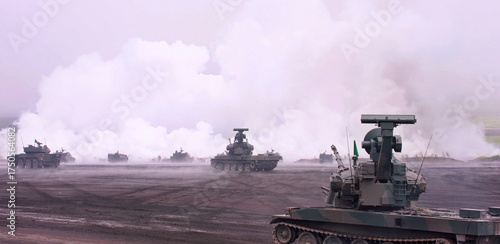 The advanced radar system, likely part of an air defense unit, surveys its surroundings amidst a smoky atmosphere, indicating ongoing operations or training maneuvers.