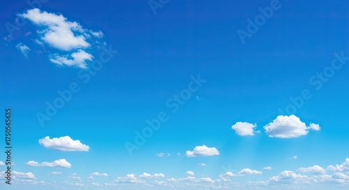A vibrant, expansive blue sky stretches endlessly, dotted with a few wispy, white clouds, signaling a beautiful and clear weather day ,peaceful ,pure ,summer