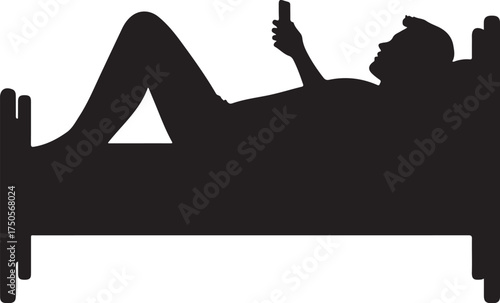 Silhouette of person lying in bed using smartphone