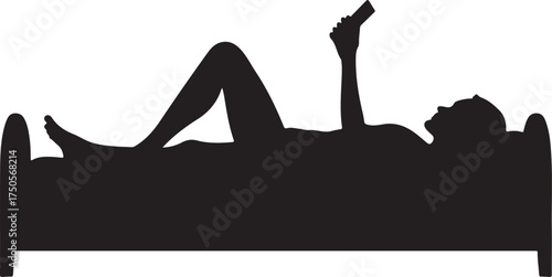 Silhouette of person lying in bed using smartphone