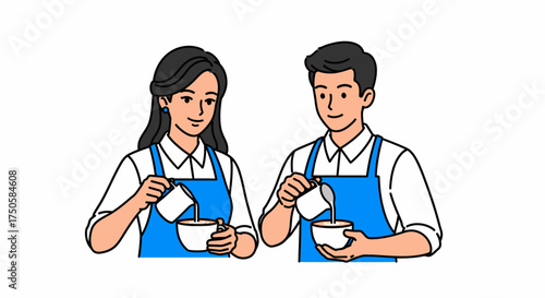 A male and female barista in blue aprons pour milk into coffee cups, working together.