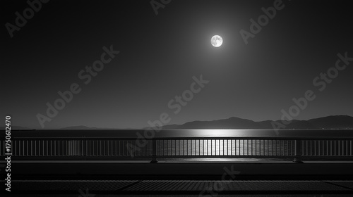 from a bridge, looking out over a calm ocean illuminated by bright moonlight
